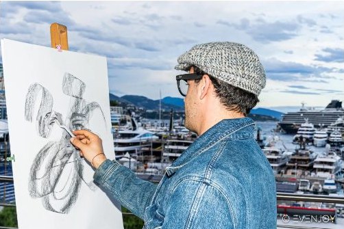 Djiango Artist dessinant en direct sur la terrasse